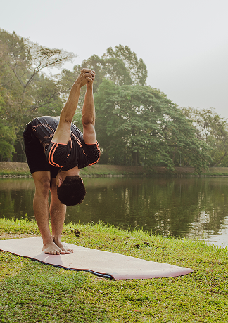 man-stretching-lake-nature